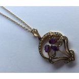 A heavy amethyst and pearl pendant in 15 carat on