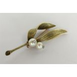 STERLE OF PARIS: A finely cast gold brooch in the