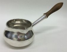 A good quality Georgian silver brandy pan with tur
