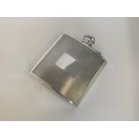 A good quality silver hip flask with hinged top. B