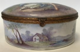 A good Continental oval hinged top porcelain box p