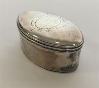 An oval silver nutmeg grater with hinged top, stee