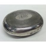 A silver engine turned tobacco pouch of oval form