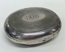 A silver engine turned tobacco pouch of oval form