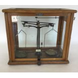 An old mahogany cased chemist scale by W George of