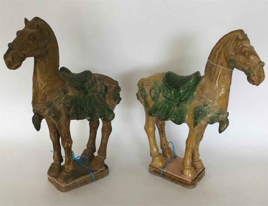 A pair of Antique carved terracotta figures of hor