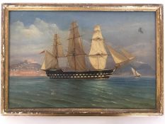 A gilt framed oil painting of a ship on coastal wa