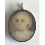 An 18th Century gold framed miniature of a lady. A