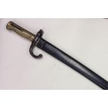 An Antique brass and steel bayonet. Est. £30 - £40