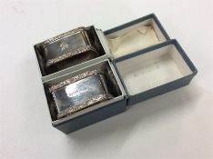 A pair of heavy engine turned silver napkin rings