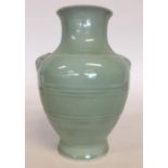A Chinese celadon-ground oviform vase with moulded