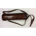 A good quality leather flask case with hinged top.