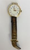 A lady's 18 carat wristwatch with white enamelled