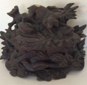 A good quality carved oak Black Forest caddy decor