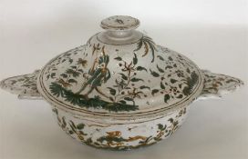 A Faience tin-glazed two-handled circular pot and