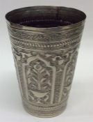 A Continental silver beaker decorated with flowers