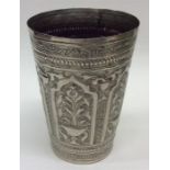 A Continental silver beaker decorated with flowers