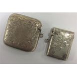 A good silver scroll decorated vesta with hinged t