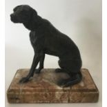 A good quality bronzed figure of a dog in seated p