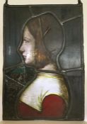 An unusual Antique stained glass panel of a lady i