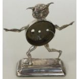 A novelty silver watch holder in the form of a jok