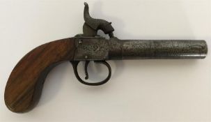 A pocket pistol with chased decoration and mahogan