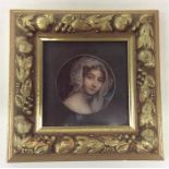 A small circular miniature of a young lady with bl