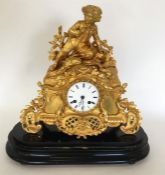 A good French gilt mantle clock with white enamell