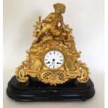 A good French gilt mantle clock with white enamell