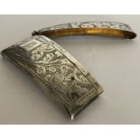 A silver hinged top card case with scroll decorati