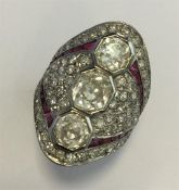 A large ruby and diamond cocktail ring, the large