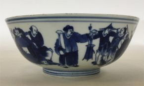 A Chinese blue and white shallow bowl decorated wi