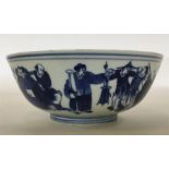 A Chinese blue and white shallow bowl decorated wi