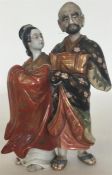 A Japanese porcelain group modelled as a courtesan