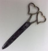 A good pair of silver mounted scissors with heart