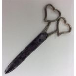 A good pair of silver mounted scissors with heart