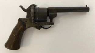 An Antique pin-fire revolver. Est. £40 - £60.