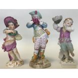 Three Continental brightly decorated figures of ch