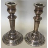 A pair of circular modern silver candlesticks. Lon