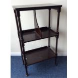 An Edwardian mahogany book stand on turned spreadi