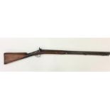 A long mahogany rifle, by Nock, with textured stoc