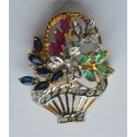 An 18 carat emerald, ruby and sapphire brooch in t