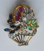 An 18 carat emerald, ruby and sapphire brooch in t