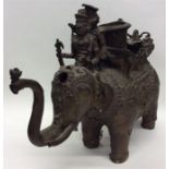 A heavy bronzed statue of an elephant of Eastern d