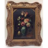 A still life of a vase of flowers in gilt frame. O