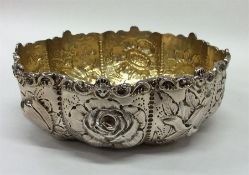 A Victorian silver bonbon dish attractively decora