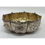 A Victorian silver bonbon dish attractively decora