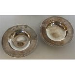 A pair of small silver Armada dishes of typical de