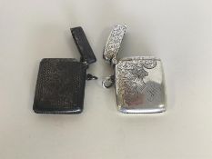 Two engraved silver vesta cases with floral decora