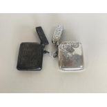 Two engraved silver vesta cases with floral decora